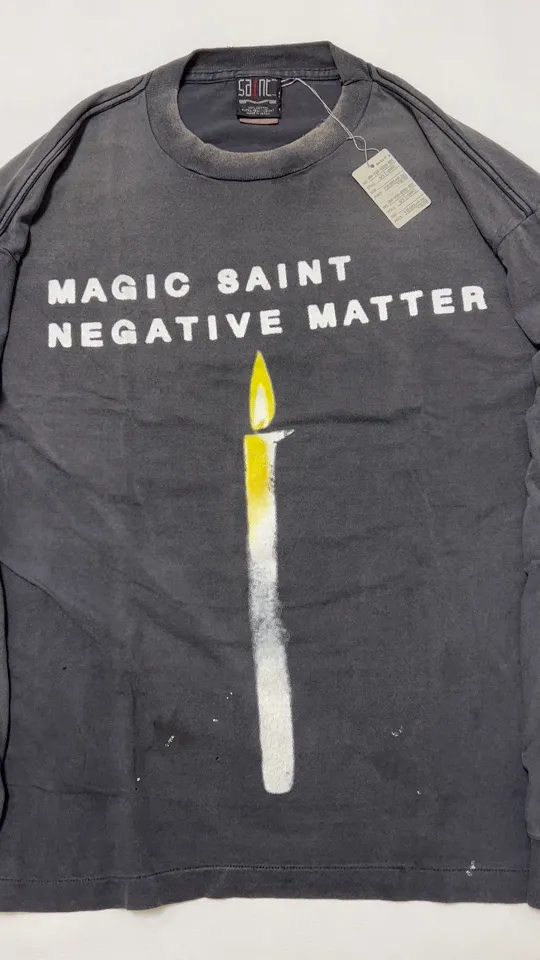 SAINT Mxxxxxx CANDLE LS TEE/BLK Slogan candle distressed long-sleeved TEE with angel short sleeves on the back. Washed black S-XL. Same as the original. Cylindrical side seam OE yarn fabric. Garment dyeing. Faded by heavy washing. Faded by plaster on bust. Correct alignment. Original consistent main mark/wash mark/cherub anti-counterfeiting mark. Original level printing restoration.